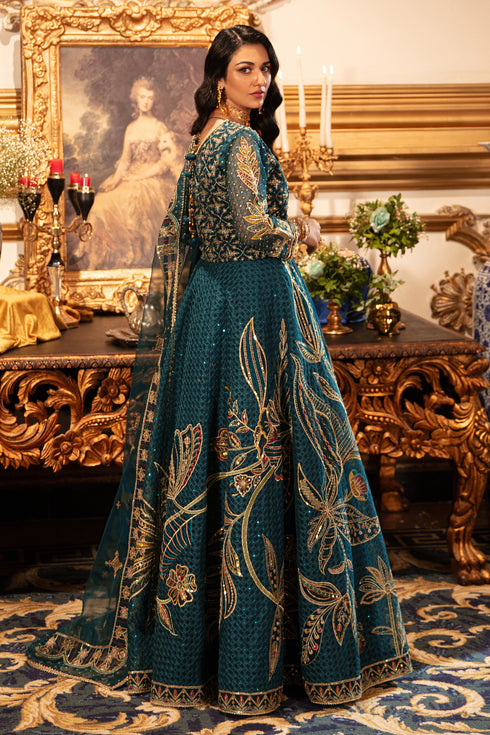 Side view of naqshi zeemal showing lehenga flare with bold floral motif embroidery, scalloped lace border, sequin detailing on choli sleeves and dupatta drape.